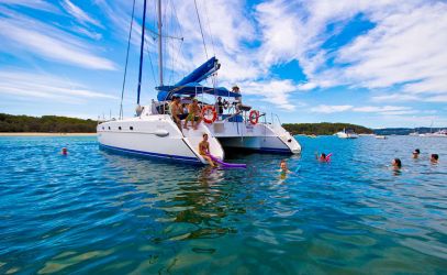Swimming in blue waters on Aristocat boat hire 