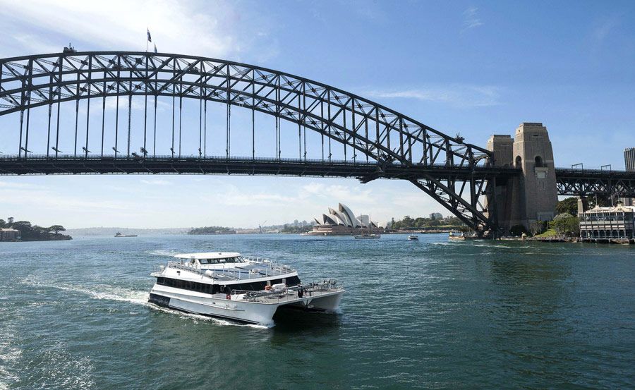 Boat hire on Harbour Spirit passing Harbour Bridge Boat hire on Harbour Spirit passing Harbour Bridge