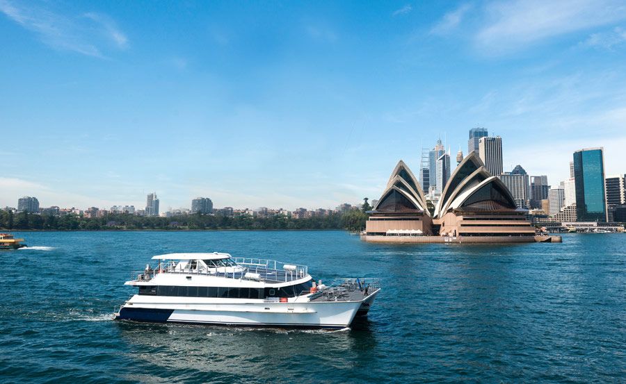 Boat hire on Harbour Spirit passing Opera House Boat hire on Harbour Spirit passing Opera House
