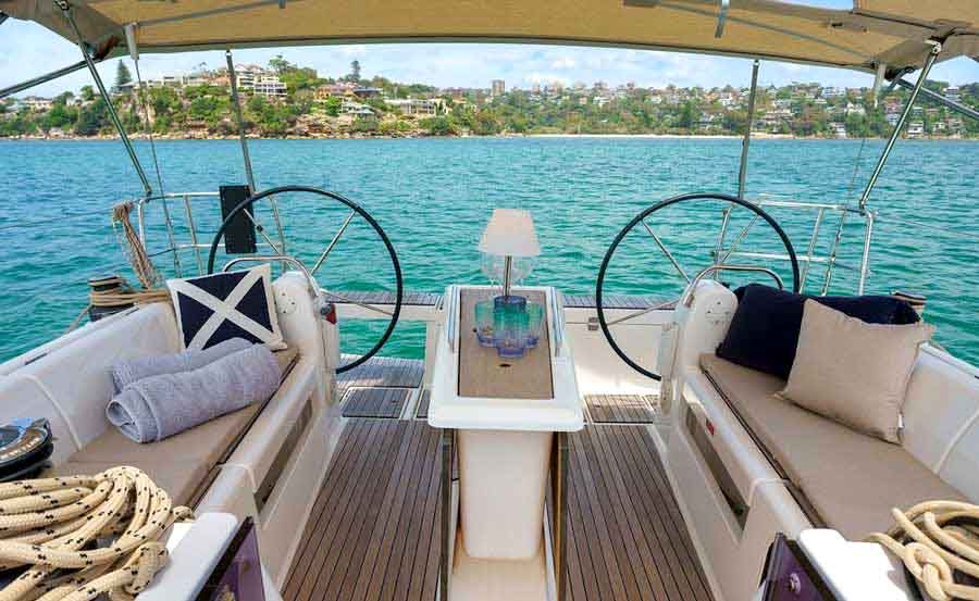 Sailing Sydney on Cavatina unfolded table with lounges 