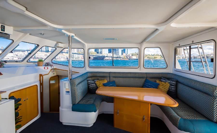 Vivid Cruises on Enigma X Main Saloon with Seating Section Vivid Cruises on Enigma X Main Saloon with Seating Section