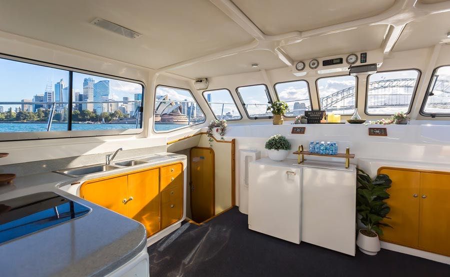 Boat Hire on Enigma X Main Saloon with bathroom entrance