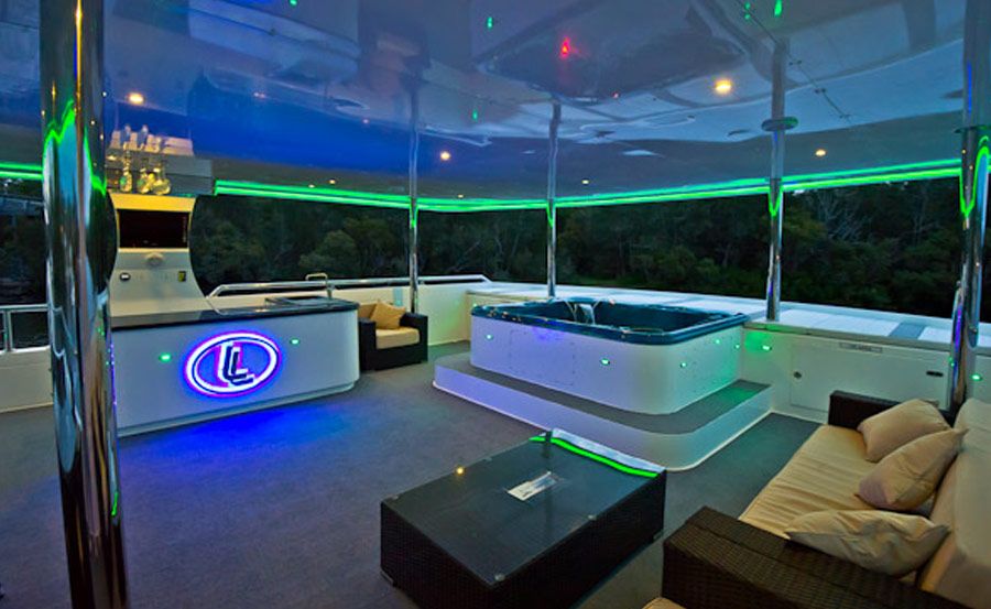 harbour cruise on Karisma with neon lights
