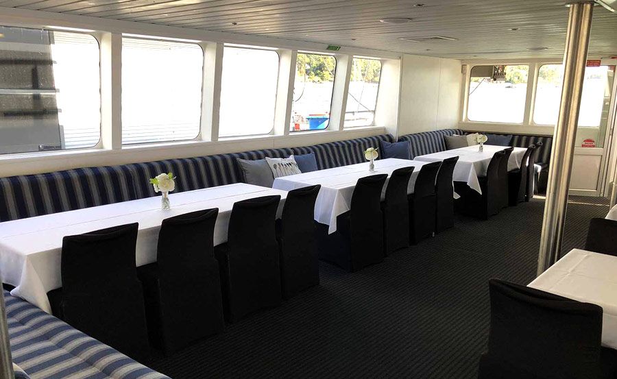 Formal dining setting for harbour cruise on Harbour Spirit Formal dining setting for harbour cruise on Harbour Spirit