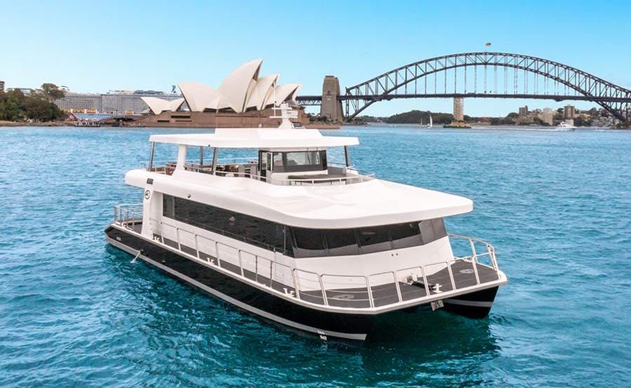 School Socials on Karisma II bow view in front of the harbour bridge School Socials on Karisma II bow view in front of the harbour bridge