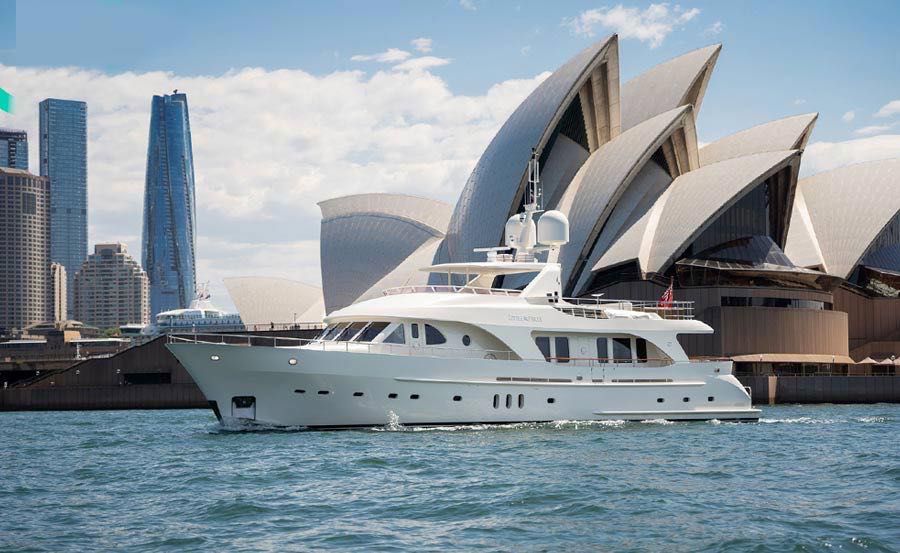 Super Yacht Hire Sydney on Little Perle Opera House background Super Yacht Hire Sydney on Little Perle Opera House background