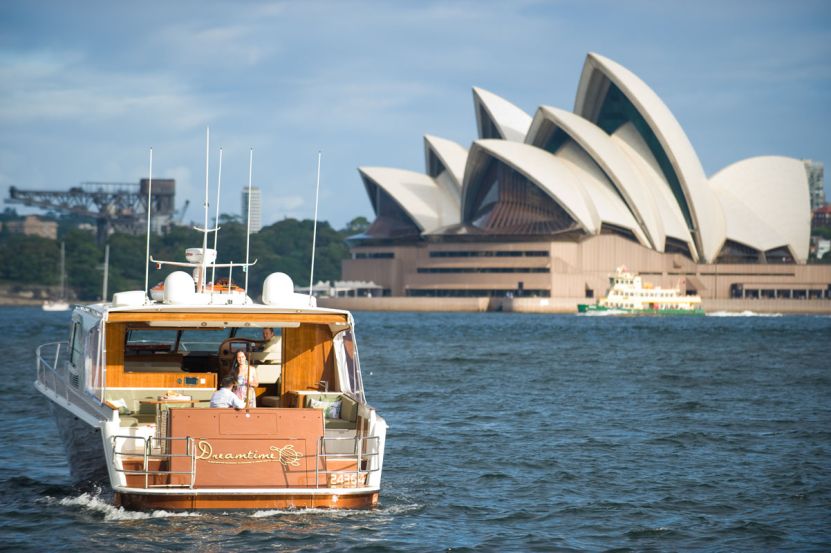 Luxury boat hire on Dreamtime passing Opera House Luxury boat hire on Dreamtime passing Opera House