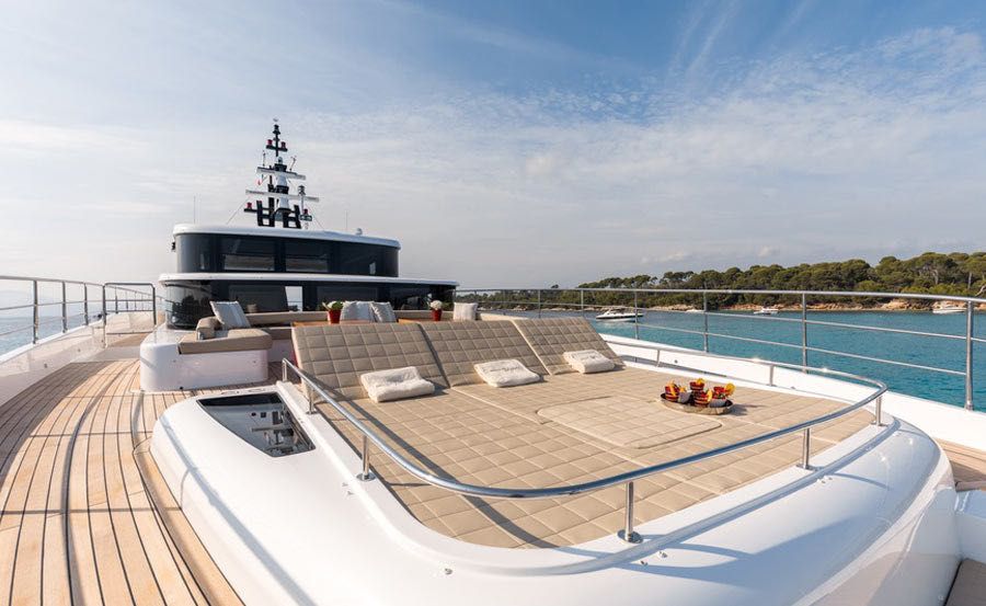 Whitsundays Super Yacht Hire on ONEWORLD sun beds on bow Whitsundays Super Yacht Hire on ONEWORLD sun beds on bow