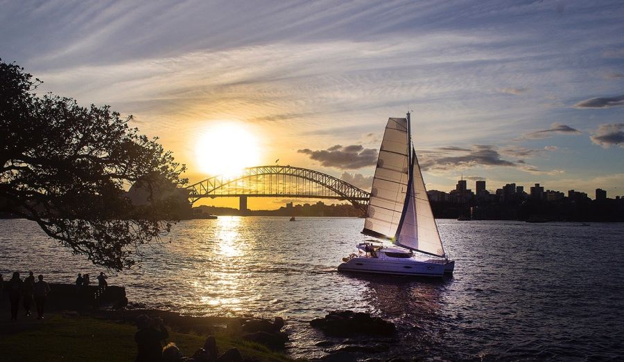 Too Up boat hire on Sydney Harbour as the sun sets
