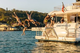 Guests jumping off Stern Swimming Platform on their Superyacht Vacation